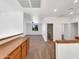Upstairs landing area with access to multiple rooms and natural light at 2014 S Archer Cir, Mesa, AZ 85209