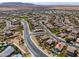 Wide aerial shot of a residential area with a view of the distant mountains in the background at 208 S La Amador Trl, Casa Grande, AZ 85194