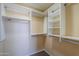 Walk-in closet with built-in shelving and hanging rods for organized storage at 208 S La Amador Trl, Casa Grande, AZ 85194