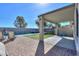 A backyard featuring a refreshing pool, covered patio, trampoline, and artificial turf at 20867 N Grantham Rd, Maricopa, AZ 85138