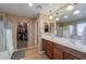 Bathroom featuring a dual sink vanity, walk-in shower, and soaking tub at 20867 N Grantham Rd, Maricopa, AZ 85138
