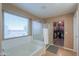 Bathroom featuring bathtub, shower and a bright window at 20867 N Grantham Rd, Maricopa, AZ 85138