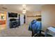 Cozy bedroom featuring carpet, desk with computer, gaming chair and closet at 20867 N Grantham Rd, Maricopa, AZ 85138
