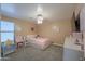 Charming bedroom with plush carpeting, a ceiling fan and a window at 20867 N Grantham Rd, Maricopa, AZ 85138
