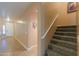 Inviting entryway with tile floors, adjacent staircase, and natural light creates a welcoming atmosphere at 20867 N Grantham Rd, Maricopa, AZ 85138