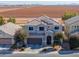 Inviting two-story home with a well-manicured front yard and solar panels on the roof at 20867 N Grantham Rd, Maricopa, AZ 85138