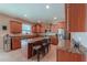 Modern kitchen with granite countertops, stainless steel appliances and a convenient island with seating at 20867 N Grantham Rd, Maricopa, AZ 85138