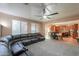 Open-concept living room seamlessly flows into a dining area and kitchen for easy entertaining at 20867 N Grantham Rd, Maricopa, AZ 85138