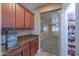 Walk-in pantry with ample shelving and storage space, accessible from the kitchen area at 20867 N Grantham Rd, Maricopa, AZ 85138