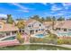 Aerial view of a home with a pool, outdoor seating area, and lake frontage at 2158 W Peninsula Cir, Chandler, AZ 85248