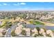 Overhead view of a golf community with lakes, green fairways, and desert landscaping at 2158 W Peninsula Cir, Chandler, AZ 85248