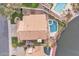 Backyard aerial view with pool, spa, patio, lush plants and lake frontage at 2158 W Peninsula Cir, Chandler, AZ 85248