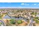 Breathtaking aerial view showcases waterfront homes along a golf course, boasting scenic views and a tranquil community setting at 2158 W Peninsula Cir, Chandler, AZ 85248