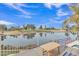 Relaxing balcony with seating overlooking a serene lake and lush golf course at 2158 W Peninsula Cir, Chandler, AZ 85248