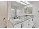 Well-lit bathroom featuring double sinks, granite countertops, and ample storage space at 2158 W Peninsula Cir, Chandler, AZ 85248