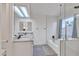Modern bathroom featuring double sinks with granite countertops and a glass-enclosed shower and tub combination at 2158 W Peninsula Cir, Chandler, AZ 85248