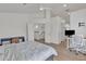 Spacious bedroom with bright white walls and natural light, featuring wood floors and neutral decor at 2158 W Peninsula Cir, Chandler, AZ 85248