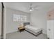 Simple bedroom featuring neutral colors, natural light, and modern furniture at 2158 W Peninsula Cir, Chandler, AZ 85248