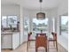 Bright dining area with a view, stylish pendant lighting, and modern furnishings at 2158 W Peninsula Cir, Chandler, AZ 85248