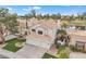 Two-story home featuring a three-car garage, tile roof, and lush landscaping at 2158 W Peninsula Cir, Chandler, AZ 85248