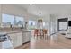 Bright kitchen with stainless steel appliances, granite countertops, and a breakfast nook overlooking the yard at 2158 W Peninsula Cir, Chandler, AZ 85248