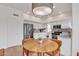 Modern kitchen featuring stainless steel appliances, white cabinets, and an eat-in kitchen table at 2158 W Peninsula Cir, Chandler, AZ 85248