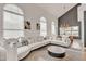 Open-concept living room with vaulted ceilings, bright white decor, and a view to the dining area at 2158 W Peninsula Cir, Chandler, AZ 85248