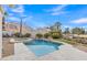 Backyard features a swimming pool, spa, and lush landscaping near the lake at 2158 W Peninsula Cir, Chandler, AZ 85248