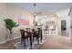 Inviting dining room with a wooden table set and a pass-through to the kitchen bar, ideal for entertaining at 21772 N Limousine Dr, Sun City West, AZ 85375