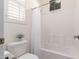 Bathroom featuring shower and tub combo with tiled walls and window at 21842 E Via De Olivos --, Queen Creek, AZ 85142