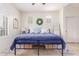 Cozy bedroom with plantation shutters and a decorative wreath above the bed at 21842 E Via De Olivos --, Queen Creek, AZ 85142