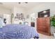 Cozy bedroom featuring a comfortable bed, natural light, and an attached bathroom, creating a private retreat at 21842 E Via De Olivos --, Queen Creek, AZ 85142