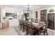Dining room with a view of the kitchen with seating for ten, a wine fridge and a chandelier at 21842 E Via De Olivos --, Queen Creek, AZ 85142