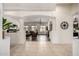 Elegant entryway with decorative pillars and arches, transitioning to the living room, showcasing the home's open design at 21842 E Via De Olivos --, Queen Creek, AZ 85142