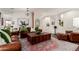 Open living room with hardwood floors, stylish decor, and views into other living areas at 21842 E Via De Olivos --, Queen Creek, AZ 85142