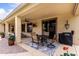 Outdoor covered patio including dining furniture, a sliding door, and a cooking area at 21842 E Via De Olivos --, Queen Creek, AZ 85142
