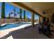 Relaxing backyard with a sparkling pool, mature landscaping, and covered patio for entertaining at 21842 E Via De Olivos --, Queen Creek, AZ 85142