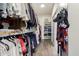 Spacious walk-in closet with custom shelving and hanging rods, providing ample storage and organization solutions at 21842 E Via De Olivos --, Queen Creek, AZ 85142