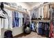 Organized walk-in closet with wooden floors, multiple rods, and shelves for optimal storage and convenience at 21842 E Via De Olivos --, Queen Creek, AZ 85142