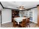 Dining area features a table set for six and an elegant hutch at 22102 W Ripple Rd, Buckeye, AZ 85326