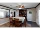 Dining room has a table set for six and built-in shelving at 22102 W Ripple Rd, Buckeye, AZ 85326