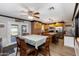 Open-concept dining area with table set for six, and a ceiling fan at 22102 W Ripple Rd, Buckeye, AZ 85326