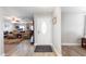 Bright foyer with wood flooring, leading to a spacious living area with comfortable seating at 22102 W Ripple Rd, Buckeye, AZ 85326