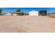 Property with a large lot, including a garage and covered parking for recreational vehicles at 22102 W Ripple Rd, Buckeye, AZ 85326