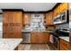 Bright kitchen features wood cabinets, stainless appliances, and granite counters at 22102 W Ripple Rd, Buckeye, AZ 85326