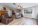 Open living area with ceiling fan and a view of the neighborhood at 22102 W Ripple Rd, Buckeye, AZ 85326