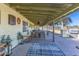Covered patio with patio furniture, outdoor grill, and stone floor at 22102 W Ripple Rd, Buckeye, AZ 85326