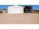 RV parking with a large covered structure and separate garage providing ample space and protection at 22102 W Ripple Rd, Buckeye, AZ 85326