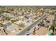 A panoramic aerial view captures a residential neighborhood, with houses closely set along cracked roads, under a clear sky at 2770 W Kent Dr, Chandler, AZ 85224