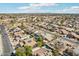 Wide aerial captures houses with pools and solar panels in a neighborhood setting, set against a scenic mountain backdrop at 2770 W Kent Dr, Chandler, AZ 85224